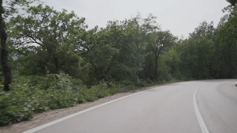 POV view from the car driving down the road. Footage. Rear view of the car, the Stock-Footage 220113347