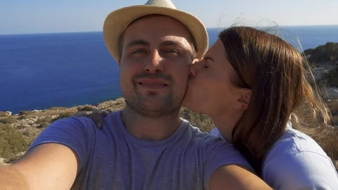 POV view of couple do selfie at edge of cliff. Breathtaking view of Stock Footage 99060397