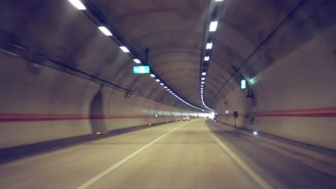 Pov view of drive at high speed through the tunnel to the light Stock Footage 133714360