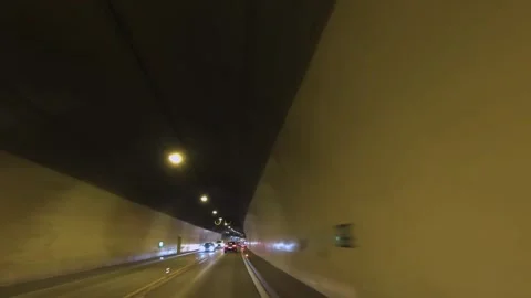 Pov view of drive at high speed through the mountain tunnel Stock Footage 272252765