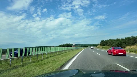 Pov view of driving down e77 motorway with Checiny castle ruins visible in .. Stock Footage 319408971