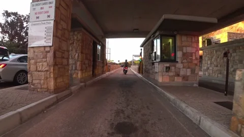 POV view driving through the toll road pay gate at Chapman's peak drive Vídeo Stock 200812019