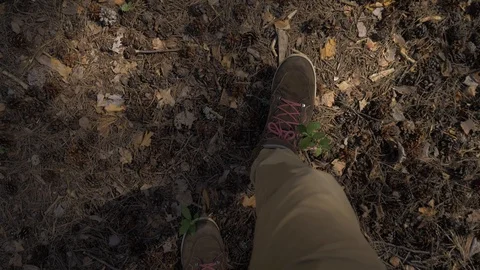 POV The view from the eyes down on a man walking in brown pants and boots with Stock Footage 108231152