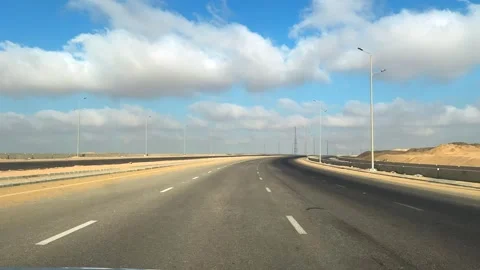 POV view of fast motion on desert highway with no traffic under clear blue sky Stock Footage 340869126