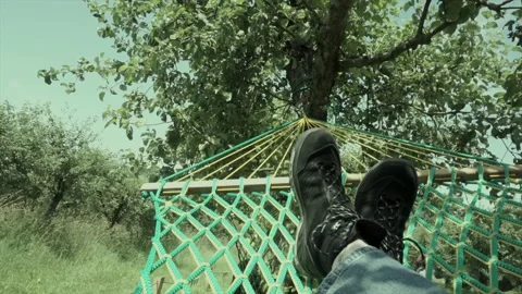 POV view from hammock with hiking boots | Relaxing in forest nature Stock Footage 311918669