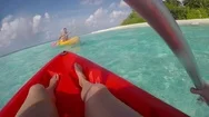Pov View Of A Man And Woman Couple Kayaking Around A Tropical Island. Stock Footage