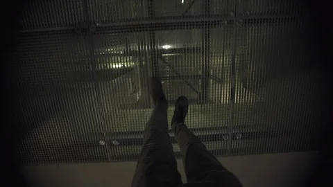 POV view of a man playing video game walking slowly on a metal grid high above Video stock 119365403