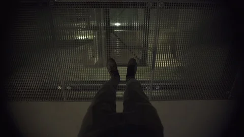 POV view of a man playing video game walking on a metal grid high above the Stock Footage 119365480