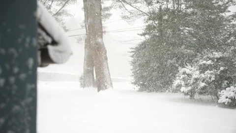 POV view out front door of snowed-in rural house during winter snowstorm Stock Footage 150847589