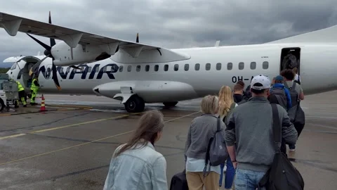 POV view of passengers queuing on the tarmac at Kajaani Airport before boarding Stock Footage 342913706