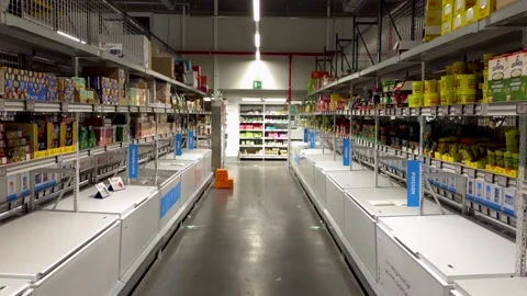 POV view through an empty Colruyt supermarket aisle with freezer compartments Stock Footage 345198431
