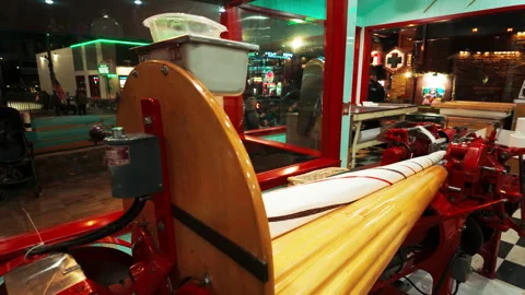 POV view of traditional candy-making equipment, creating a nostalgic and lively Stock Footage 321042596