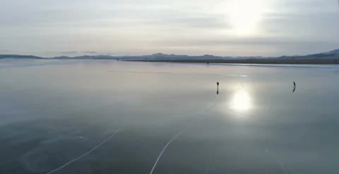 Pov view winter fun outdoor Ice skating on clear smooth surface of frozen lake Video stock 103851432