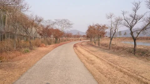 POV Walk Forward on Riverside Trail in Autumn, Suncheon South Korea 스톡 동영상 324960840