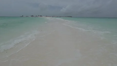 POV Walking Along Pristine Sandbar with Waves Crashing at Cayo de Agua Los Stock Footage 342671602