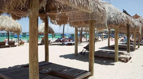 POV walking at beautiful beach by beach chairs in Sunny Isles-Miami Stock Footage 62836218