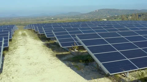 Pov walking between solar panels on a green energy farm, Provence, France Stock Footage 292809013