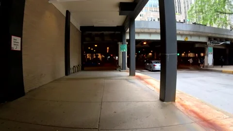 POV walking on a covered sidewalk in Chicago Stock Footage 279680127