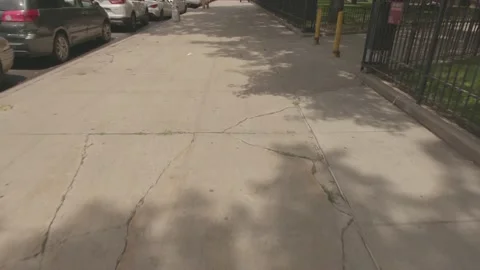 POV, walking down city sidewalk.   Daytime Summer  4K Stock Footage 141406255