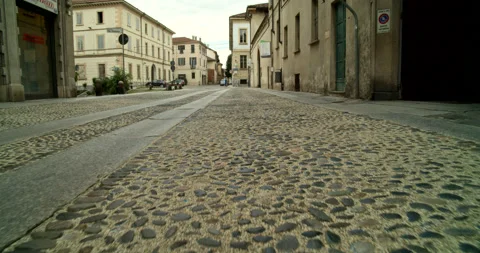 POV Walking Down a Classic Cobblestone Street in Pavia, Italy Stock Footage 203563106