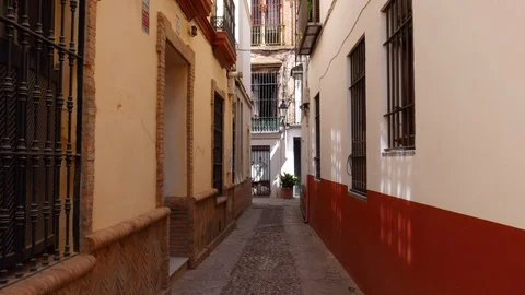 POV walking down old picturesque passageway in the medieval Jewish Quarter of Stock Footage 116270522