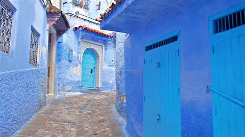 POV walking in empty blue walls and doors street, Chefchaouen, Morocco Stock-Footage 311808211