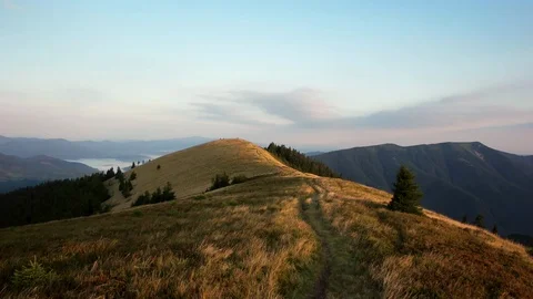 POV walking on fall path to woods, valley and mounts at sunset with beautiful Stock-Footage 88957827