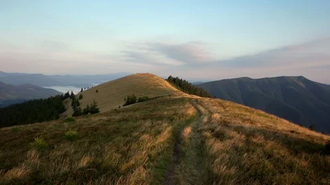 POV walking on fall path to woods, valley and mounts at sunset with beautiful Stock Footage 88958091