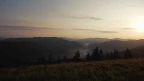 POV walking on fall path to woods, valley and mounts at sunset with beautiful Stock-Footage 88958217