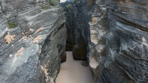 POV walking on a hidden path between two large rocks Stock-Footage 129392065