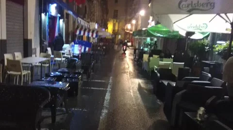 POV walking at nighttime. Sidewalk Caffe' and Bars in Catania city. Stock Footage 44350993