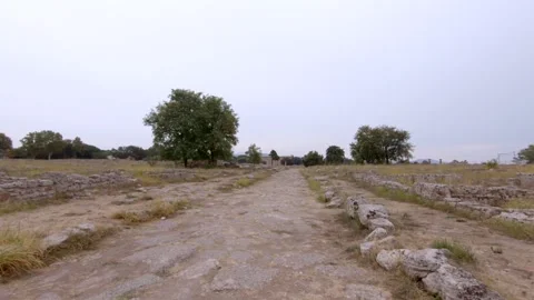 POV - Walking the path in Archaeological Park of Paestum, italy, Europe Tourism Stock Footage 145420996