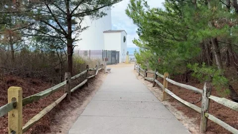 POV Walking Path Toward Lighthouse in Coastal Park, Barnegat Light, New Jersey Vídeos de archivo 328755151