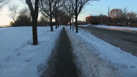 Pov walking on snowy sidewalks Stock Footage