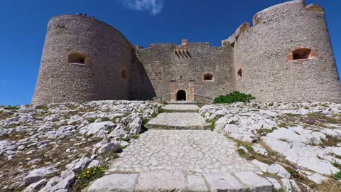 POV walking up the stone path toward the main entrance of Chateau d'If Stock Footage 345176269