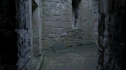 POV Walking through dark and light medieval Castle stone Stock Footage 128670032