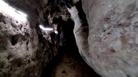 POV Walking Through a Dark Underground Limestone Cave in Vietnam 動画素材 340935019