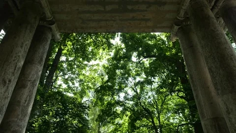 POV walking through the "Mask" stone monumental portal in Gatchina Palace Park Stock Footage 317199277