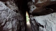 Pov Walking Through Narrow Rock Tunnel Stock Footage