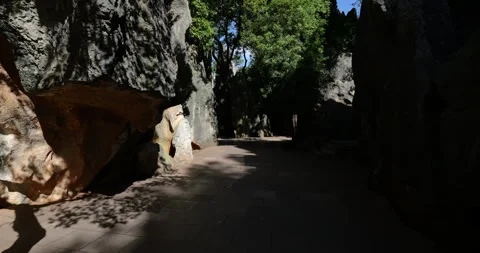 POV walking through the Shilin Stone Forest in Kunming, China Видео 329463590