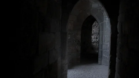 POV walking through stone day lit corridors in a medieval Castle Stock Footage