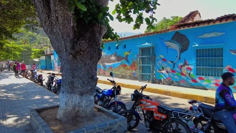 POV walking through the streets of Choroni, with colorful colonial-style houses Stock Footage 333380318