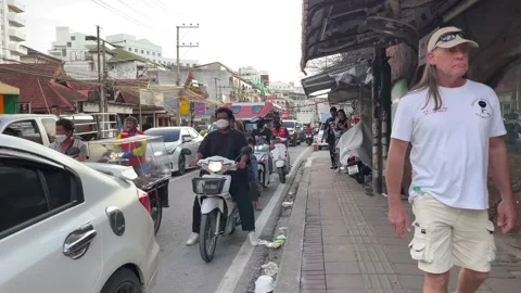 POV walking time lapse dolly shot on sidewalk at Pattaya city. Vehicles on road Stock Footage 225113308