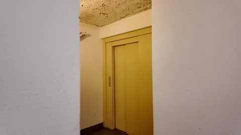 POV Walking Towards Old Elevator Door Stock Footage 318706635