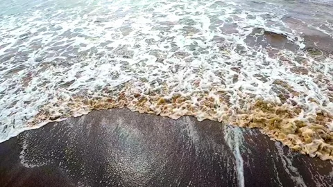 Pov waves slow motion video of milky waves hitting shore 動画素材 344636340
