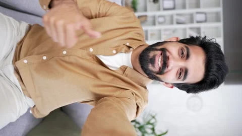 POV Webcam view. Vertical video. Young handsome man talking on a video call  Stock Footage 252213331