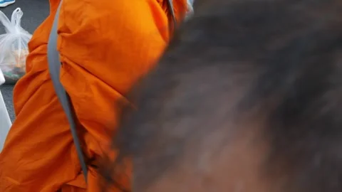 Pov while give alms to monks with set of dried food were packed in a plasti.. Stock Footage 318123771
