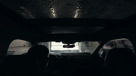 POV wide footage Driver inside vehicle entering automatic car wash with visible Stock Footage 332183560