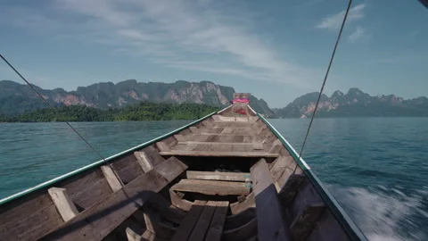 POV Wide Shot from Inside a Moving Longtail Boat on Cheow Lan Lake, Majestic Stockbeeldmateriaal 334643472