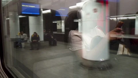 POV window view from a departing train at Brussels Central, passing waiting Vídeos de archivo 346885125
